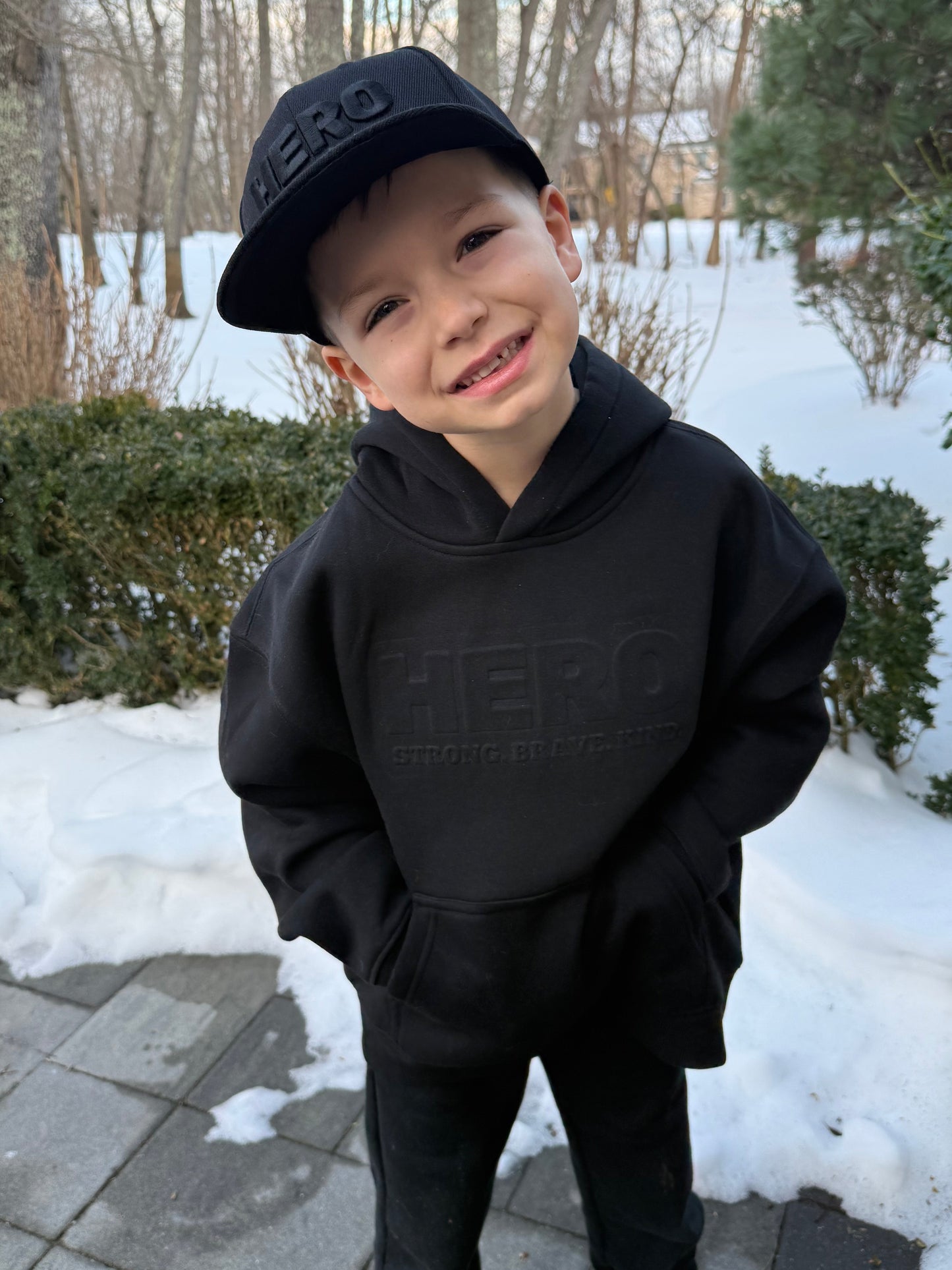 “Raised to be a Hero” Premium Embossed Hoodie