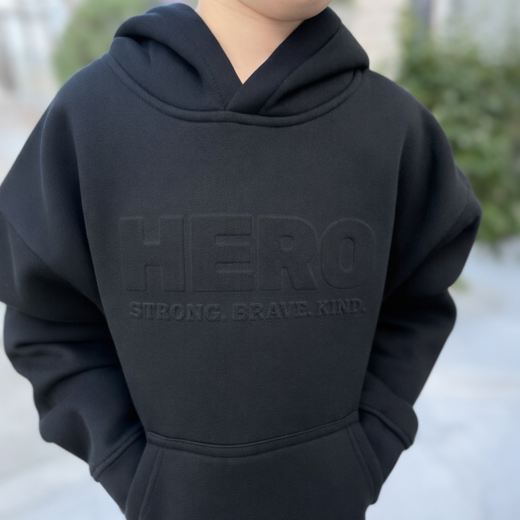 “Raised to be a Hero” Premium Embossed Hoodie