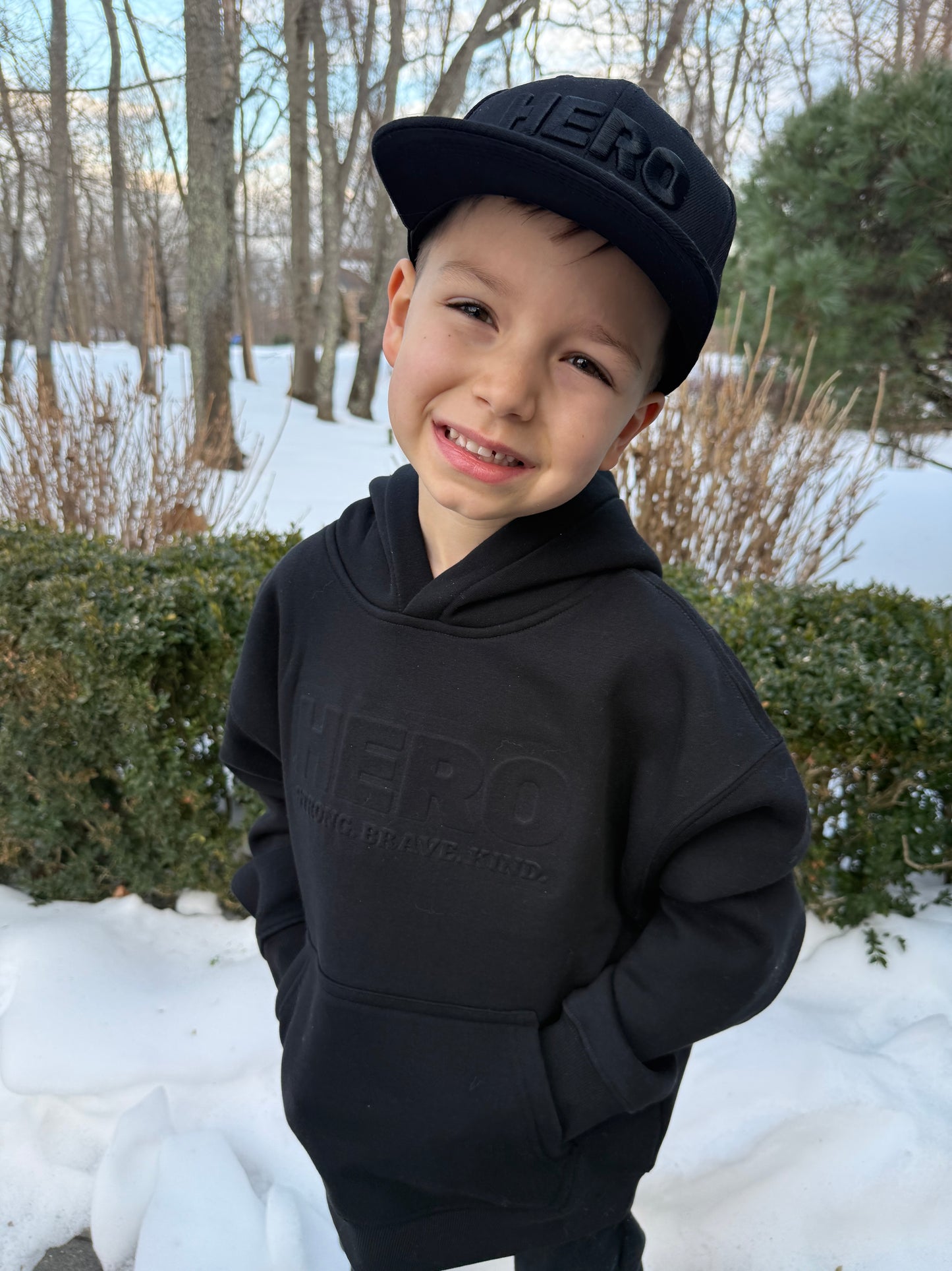 “Raised to be a Hero” Premium Embossed Hoodie